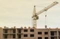 View of a large construction site with buildings under construction and multi-storey residential homes. Tower cranes in Royalty Free Stock Photo