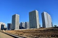 View of a large construction site with tall residential buildings and skyscrapers. Road and road junction construction. Royalty Free Stock Photo