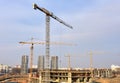 View of a large construction site. Tower cranes in action. Housing renovation concept. Crane during formworks. Construction the Royalty Free Stock Photo