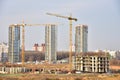 View of a large construction site. Tower cranes in action. Housing renovation concept. Crane during formworks. Construction the Royalty Free Stock Photo