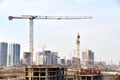 View of a large construction site. Tower cranes in action. Housing renovation concept. Crane during formworks. Construction the Royalty Free Stock Photo