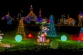 View of a Large Drive Thru Christmas Display, With Lots of Colored Lighted Tree, Buildings, Bushes