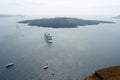 A large passenger liner, small ships and a volcanic island in th Royalty Free Stock Photo