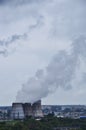 View of the large pipes from which steam rises Royalty Free Stock Photo