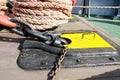 View of large ropes on a ship and chains.