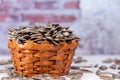 The view of large salted roasted sunflower seeds in a small basket.