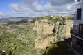 view of a large valley under the city on a cliff.