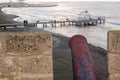 Rusty canon at Larnaca Castle pointing at Larnaca Pier, Cyprus Royalty Free Stock Photo