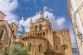 View of lateral facade and cupola of the gothic building of Coimbra Cathedral, Coimbra city and sky as background