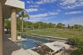 View of lawn from swimming pool in luxury mansion Royalty Free Stock Photo