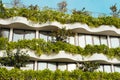 View of layered eco-friendly building facade with green shrubs and trees Royalty Free Stock Photo