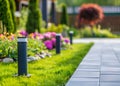 View of led lighting solar lamp in daytime in a green garden.