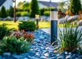 View of led lighting solar lamp in daytime in a green garden. Royalty Free Stock Photo