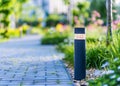 View of led lighting solar lamp in daytime in a green garden. Royalty Free Stock Photo