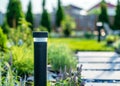 View of led lighting solar lamp in daytime in a green garden. Royalty Free Stock Photo