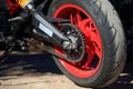 Rear wheel with red rim of motorcycle, close-up