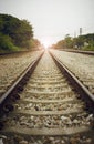 View of the length of railway with green tree at left and right side of railway,filtered image, light effect and flare added Royalty Free Stock Photo