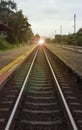 View of the length of railway with pavement at left and right side of railway,filtered image, light effect and flare added Royalty Free Stock Photo