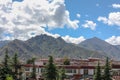 A view on Lhasa roofs , mountains and clouds in Tibet Royalty Free Stock Photo