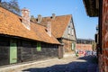 View of Liepaja old town with ancient wooden houses with clay tile roofs, many chimneys