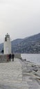 View of the lighthouse of city of Camogli, Genoa Province, Liguria, Mediterranean coast, Italy Royalty Free Stock Photo