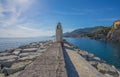 View of the lighthouse of city of Camogli, Genoa Province, Liguria, Mediterranean coast, Italy Royalty Free Stock Photo