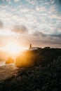 View of the lighthouse and cliffs at Cape St. Vincent in Portugal at sunset. Royalty Free Stock Photo