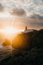 View of the lighthouse and cliffs at Cape St. Vincent in Portugal at sunset. Royalty Free Stock Photo