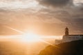 View of the lighthouse and cliffs at Cape St. Vincent in Portugal at sunset. Royalty Free Stock Photo