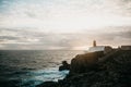 View of the lighthouse and cliffs at Cape St. Vincent in Portugal at sunset. Royalty Free Stock Photo