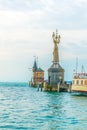 View of a lighthouse with a famous revolving statue situated in the port of Konstanz, bodensee, Germany....IMAGE Royalty Free Stock Photo