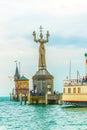 View of a lighthouse with a famous revolving statue situated in the port of Konstanz, bodensee, Germany....IMAGE