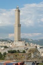 View on The Lighthouse of Genoa situated on the hill during sunny weather with clouds. Royalty Free Stock Photo