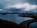 View from the Lighthouse island of StykkishÃÂ³lmur, Iceland with couldy weather on the ocean and a road