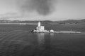 A view of lighthouse in Olbia gulf on sunset hour Royalty Free Stock Photo