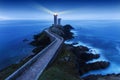 View of Lighthouse the Phare du petit minou in Plouzane, at sunset with red light , Brest , France, Brittany