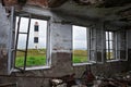 View of the lighthouse through the windows of the old house Royalty Free Stock Photo