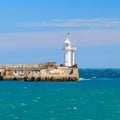 A view of the lighthouse in Yalta. Port. Crimea. Royalty Free Stock Photo