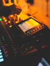 View of lighting technician operator working on mixing console workplace during live conference event, concert show broadcast, Royalty Free Stock Photo