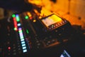 View of lighting technician operator working on mixing console workplace during live conference event, concert show broadcast, Royalty Free Stock Photo