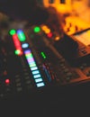 View of lighting technician operator working on mixing console workplace during live conference event, concert show broadcast, Royalty Free Stock Photo