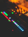 View of lighting technician operator working on mixing console workplace during live conference event, concert show broadcast, Royalty Free Stock Photo