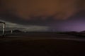 View of lightning strike over a rural farm field, lightning strikes the ground, strong thunder, lightning, dark clouds in the sky