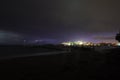 View of lightning strike over a rural farm field, lightning strikes the ground, strong thunder, lightning, dark clouds in the sky