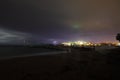 View of lightning strike over a rural farm field, lightning strikes the ground, strong thunder, lightning, dark clouds in the sky