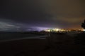 View of lightning strike over a rural farm field, lightning strikes the ground, strong thunder, lightning, dark clouds in the sky