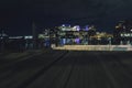 View of lights in the buildings at night seen from Boston Harbor deck