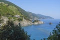 View of the Ligurian sea, cliffs, and mountains from Monterosso town to the other four towns of the national park Cinque Terre Royalty Free Stock Photo