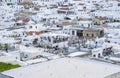 View from the Lindos Acropolis of Roof Top Restaurants Filled with People in the Village Below