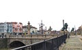 View of the Lion Bridge from 1889 with lion sculptures, ancient buildings, traffic lights and Vladaya river